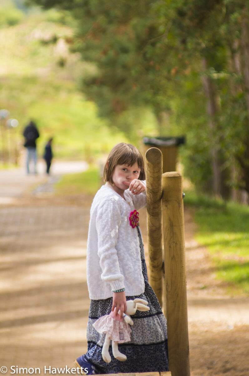 Emma with a toy rabbit looking towards me