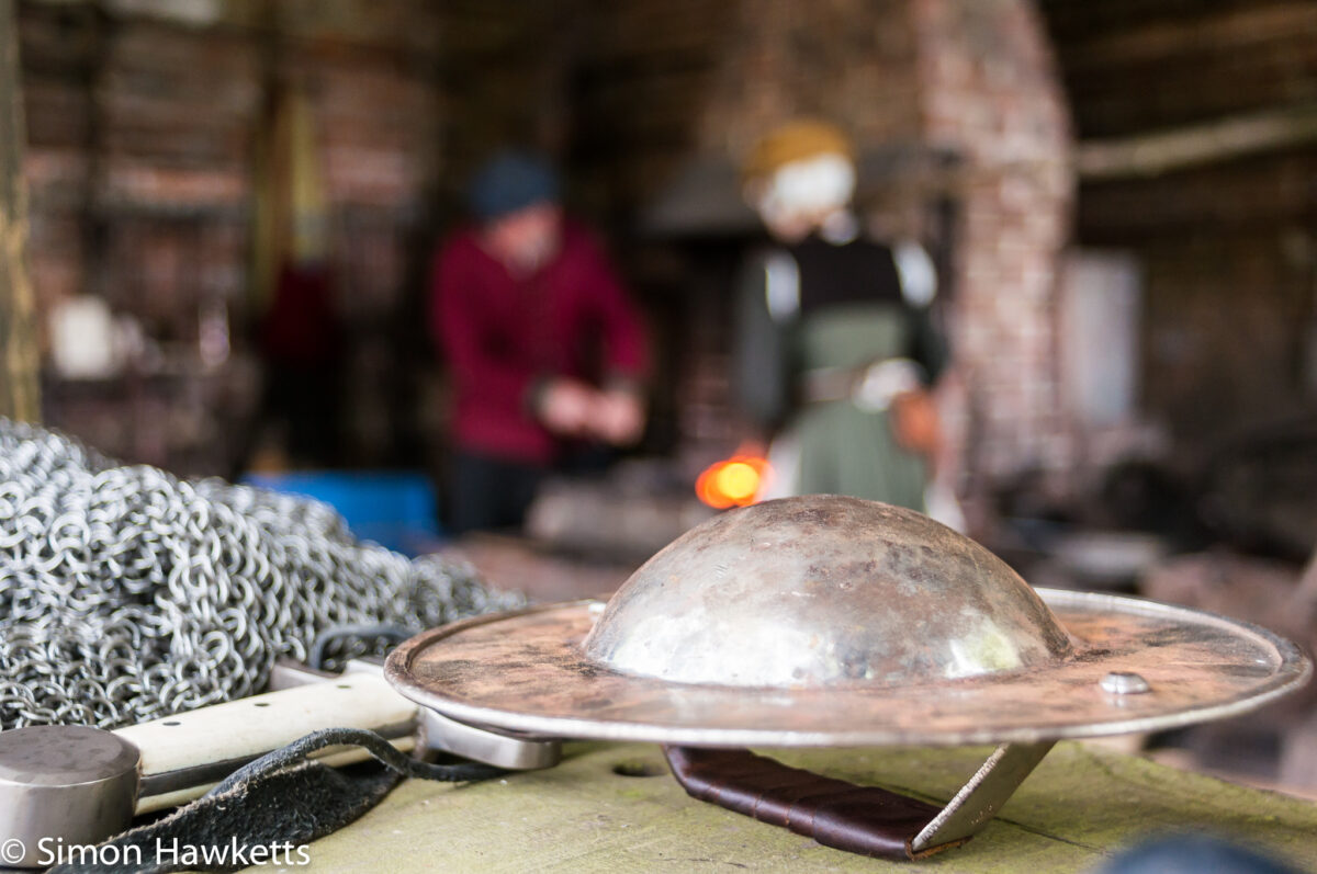 A small hand shield sitting by the forge at Kentwell Hall in Suffolk