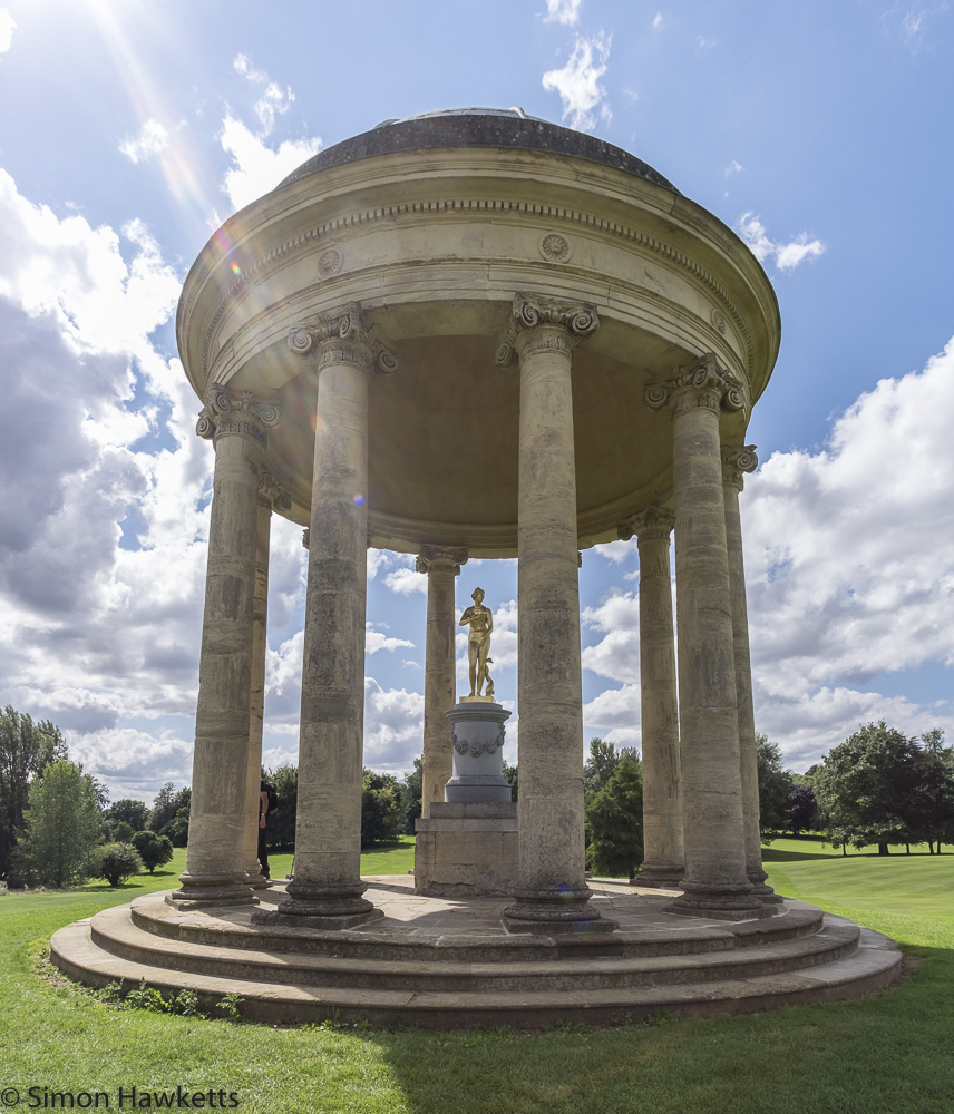 Fuji X-T1 Pictures at Stowe - a gold statue in a stone circular open pillared building